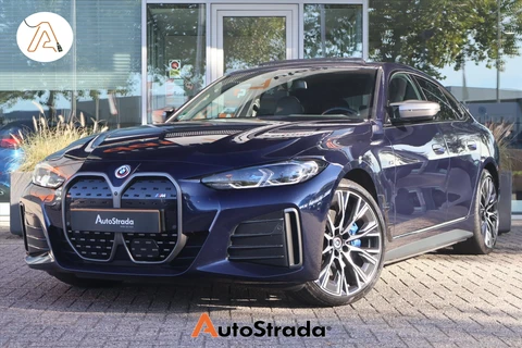 BMW I4 (g26) M50 544pk M-Sport SoH 94% | Tansanietblau | Pano | 360 CAM | Laser | Harman/Kardon | Trekhaak |