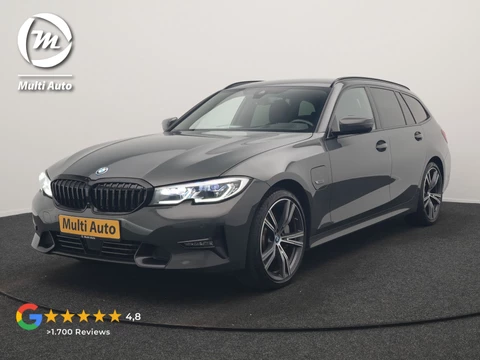 BMW 3 Serie Touring 330e Sportline PHEV 293pk Dealer O.H. | Dravitgrau | Trekhaak Af Fabriek | Adaptive Cruise | Laser LED | Head Up | Adaptief Onderstel | Camera | Sportstoelen Verwarmd | Sfeerverlichting | Keyless | Blis | Apple Carplay | 19"L.M | Plug In Hybrid |