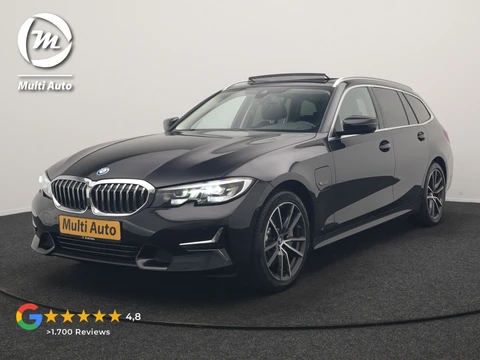 BMW 3 Serie Touring 330e Luxury Line PHEV 293pk Dealer O.H. | Trekhaak Af Fabriek | Panodak | 360 Camera | Lederen Sportstoelen Memory & Verwarmd | Keyless | Blis | Sfeerverlichting | Apple Carplay | Navigatie | DAB | Plug In Hybrid |