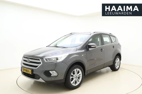 Ford Kuga 1.5 EcoBoost Titanium | Trekhaak | Achteruitrijcamera | Airco | Navigatie | Elektrische achterklep | Cruise control | Start/Stop bediening | Climate control | Parkeersensoren | Lederen/stof interieur | Stuurbediening