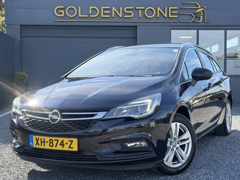 Opel Astra Sports Tourer 1.4 Turbo Online Edition ✓150pk✓2e Eigenaar✓Camera✓Carplay✓Navi✓Pdc V+A✓Stoelverw✓Stuurverw✓Clima✓Cruise✓Lm velgen✓6 Bak✓Comfortstoelen✓Dealer Onderhouden✓N.A.P✓Bj 12-2018✓Apk tot 01-2027