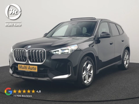 BMW iX1 xDrive30 67 kWh 313pk Dealer O.H. | Trekhaak Af Fabriek | Panodak | Adaptive Cruise | Head Up | 360 Camera | Harman / Kardon | Adaptief Onderstel | Lederen Sportstoelen Massage & Verwarmd | Stuur Verwarmd | Hifi Audio | Keyless | Blis |