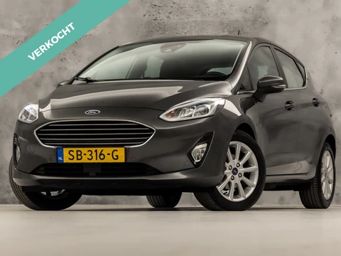 Ford Fiesta 1.0 EcoBoost Titanium (APPLE CARPLAY, GROOT NAVI, STUUR/STOELVERWARMING, BANG&OLUFSEN, CAMERA, KEYLESS, ADAPTIVE CRUISE, NIEUWE APK, NIEUWSTAAT)