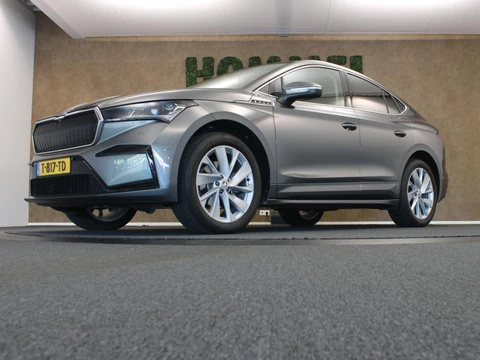 Skoda Enyaq Coupé iV 60 Business Edition Plus - SOH 94,15% !!!- ORIGINEEL NEDERLANDSE AUTO - AFKOMSTIG VAN 1E EIGENAAR - 3 FASE - NAVIGATIE - PANORAMADAK - PARKEERSENSOREN VOOR/ ACHTER - CAMERA - ELEKTRISCHE STOELVERSTELLING BESTUURDERSSTOEL - ELEKTRISCHE ACHTERKLEP - LEDEREN BEKLEDING